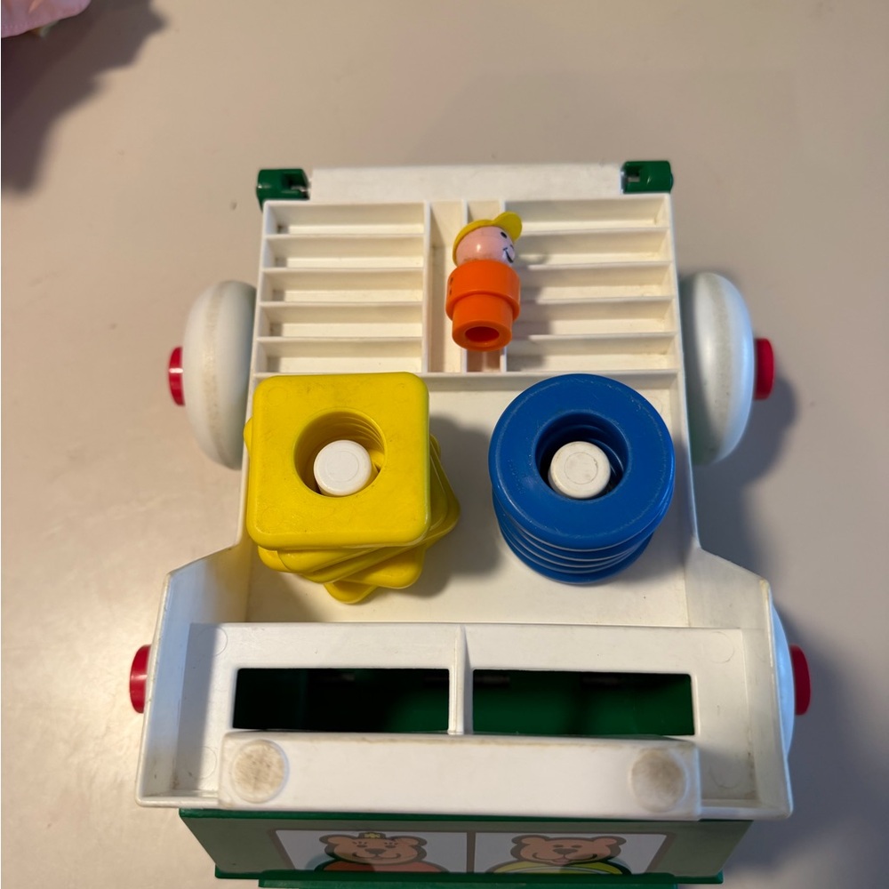 Johnson and‎ Johnson vintage stacking rings pull string truck toy with person